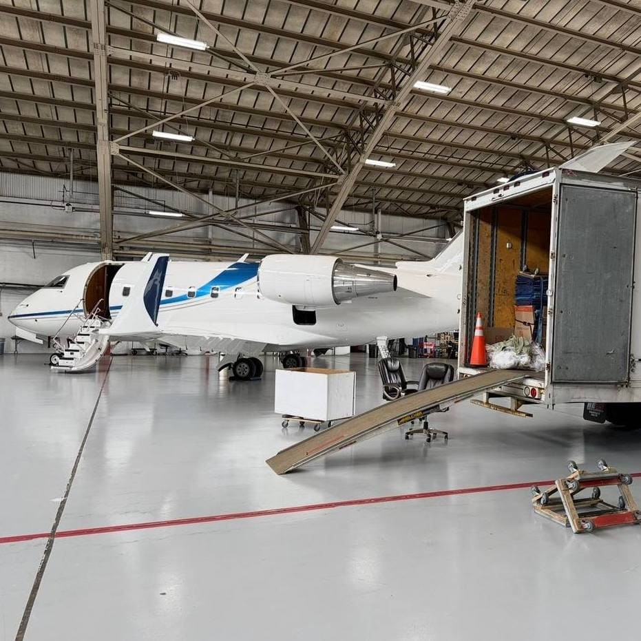 VIP Movers packing boxes to airplane