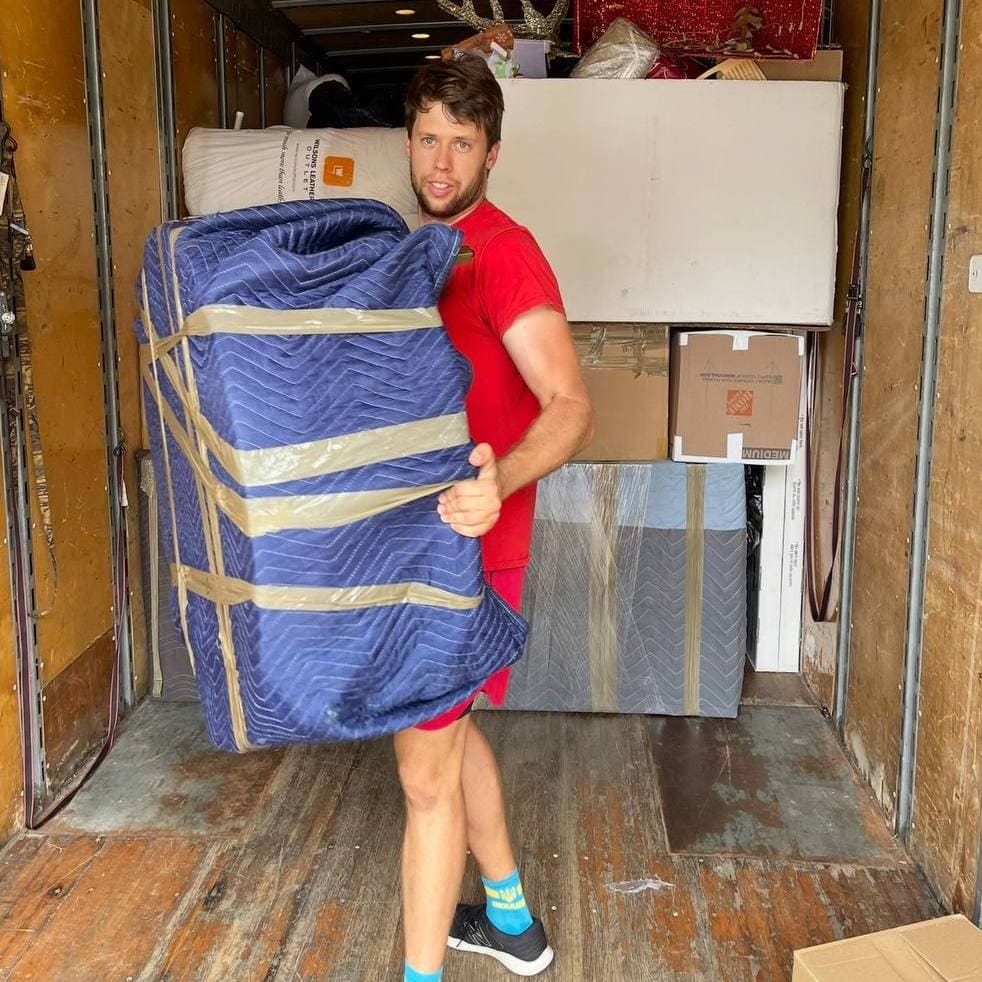 VIP Movers wrapping furniture for transport